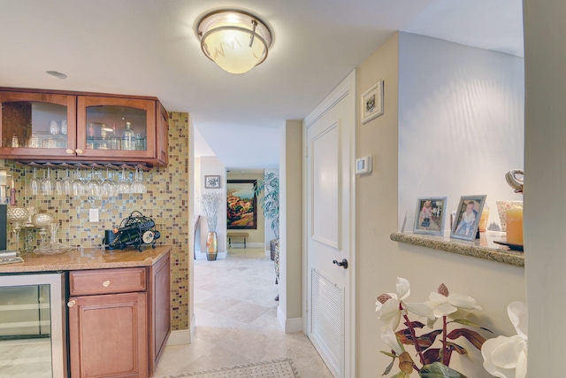 hallway with light tile patterned floors and wine cooler