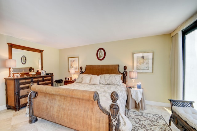 bedroom featuring baseboards