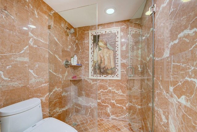 bathroom with walk in shower, tile walls, and toilet