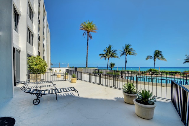 view of patio with a water view