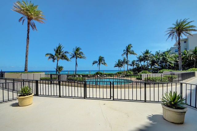 view of pool featuring a water view