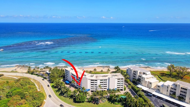 bird's eye view featuring a beach view and a water view