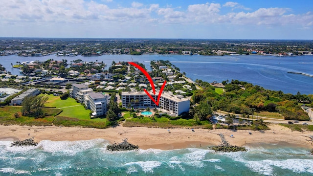 bird's eye view with a beach view and a water view