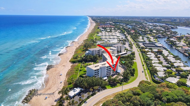 aerial view featuring a water view and a beach view