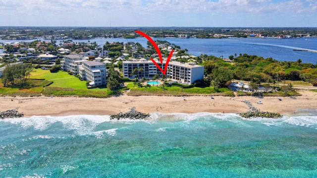 drone / aerial view with a view of the beach and a water view