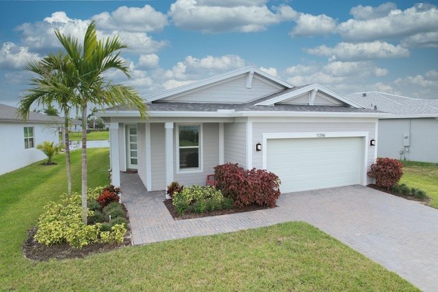 ranch-style house with a front yard and a garage