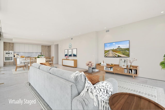 living room with light hardwood / wood-style flooring