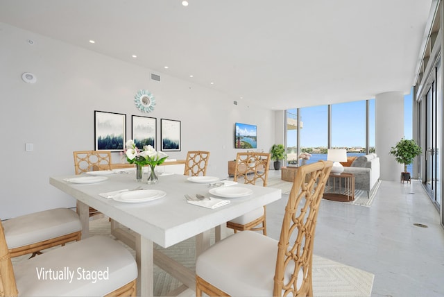 dining room featuring floor to ceiling windows