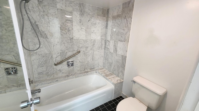 bathroom featuring tile patterned flooring,  shower combination, and toilet