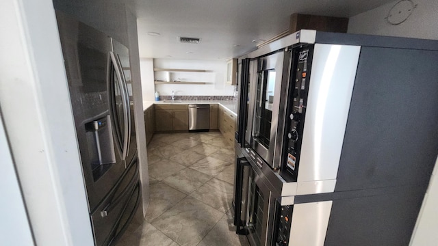 kitchen featuring stainless steel appliances and sink