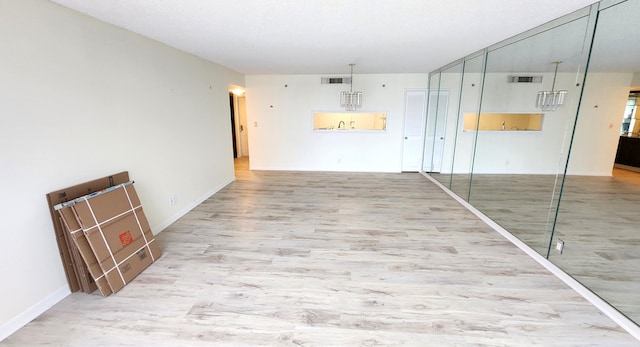 unfurnished room with hardwood / wood-style floors