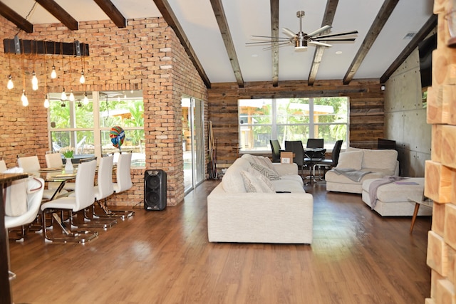 living room with dark hardwood / wood-style floors, a healthy amount of sunlight, and ceiling fan