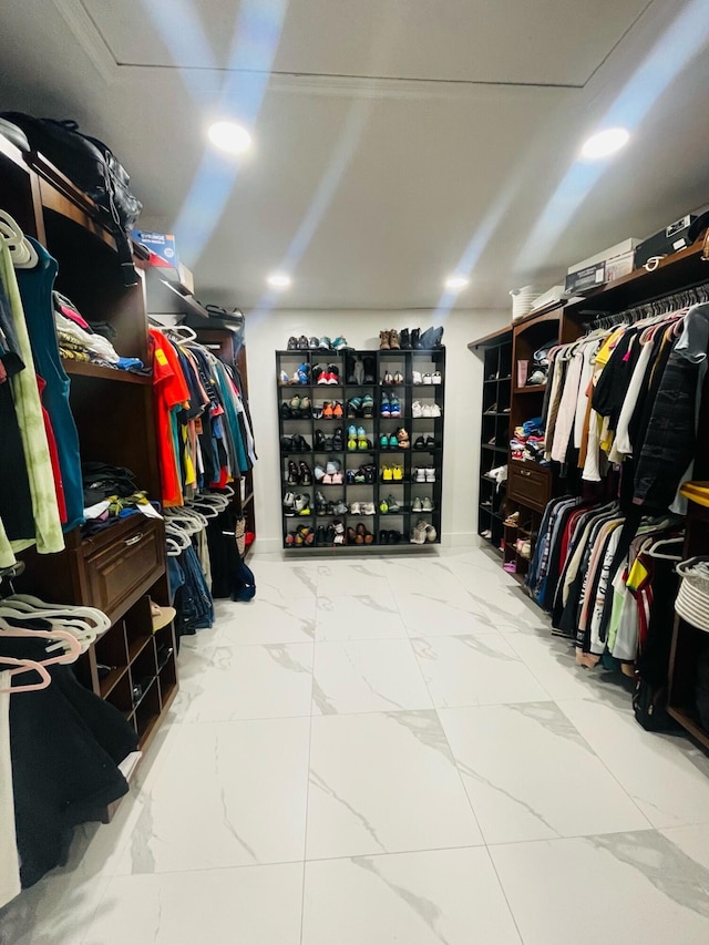 spacious closet featuring light tile flooring