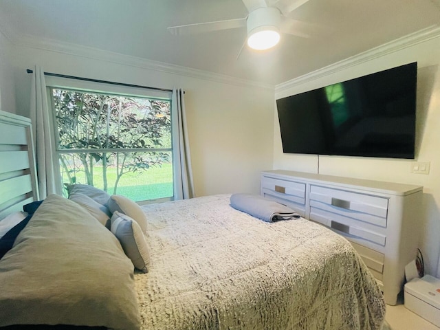 bedroom featuring ceiling fan and ornamental molding