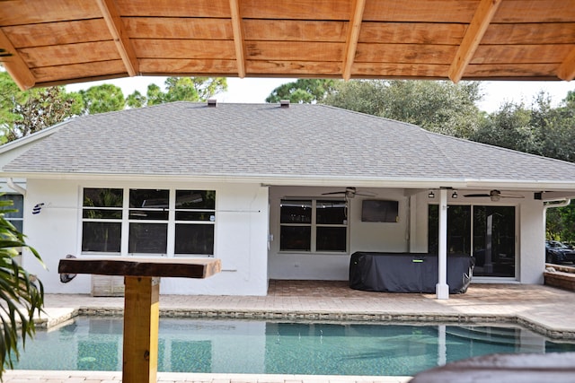 view of pool featuring ceiling fan and a patio