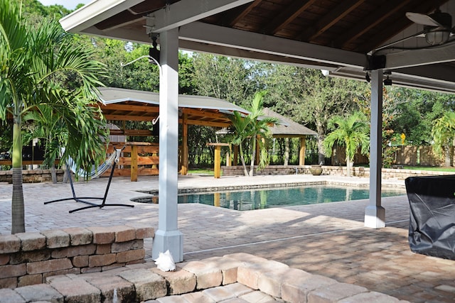 view of pool featuring a gazebo and a patio