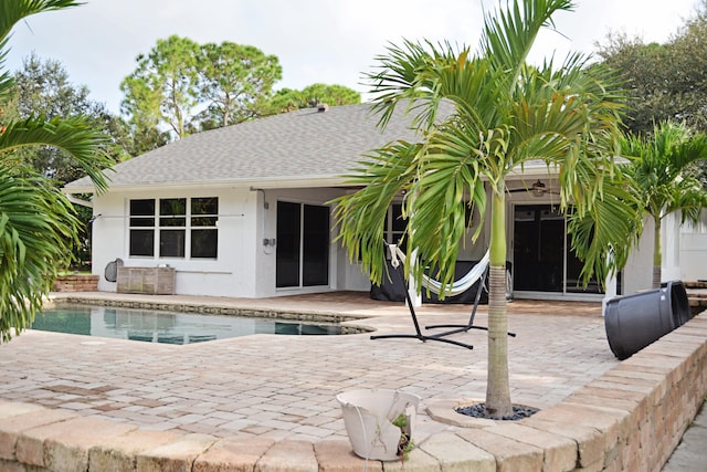 back of property with a patio