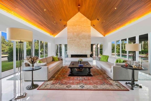 tiled living room featuring a wealth of natural light, a fireplace, and wooden ceiling