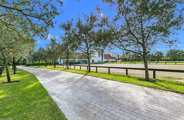 view of property's community featuring a yard