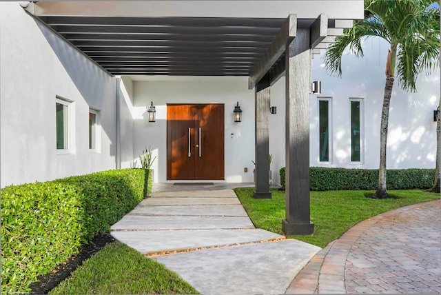 view of front of property featuring a garage and a front lawn