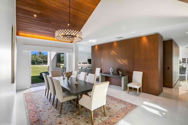 kitchen with ceiling fan, light tile patterned flooring, and stainless steel double oven