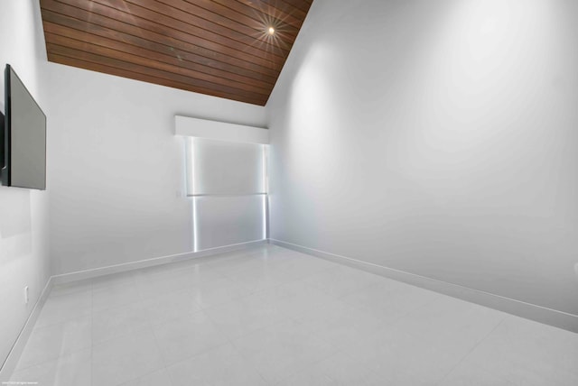 tiled bedroom with wood ceiling, white refrigerator, and lofted ceiling