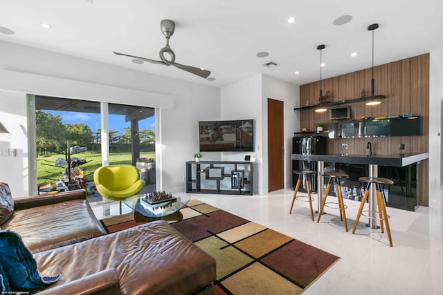 kitchen with light tile patterned floors and decorative light fixtures