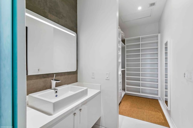 bathroom with tile patterned floors, an enclosed shower, and vanity