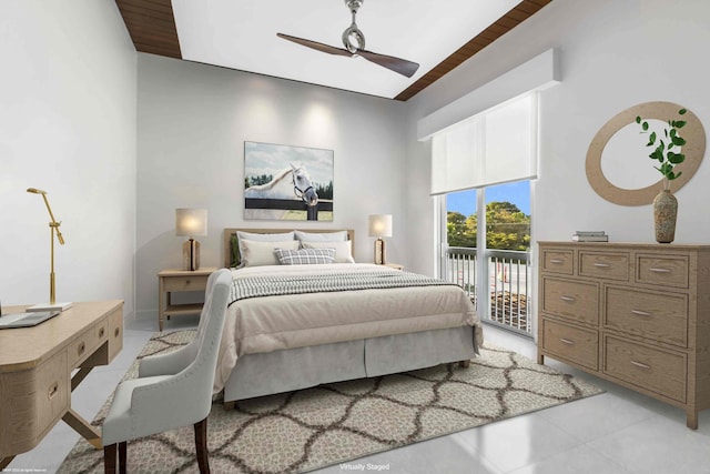 tiled spare room featuring wood ceiling and ceiling fan