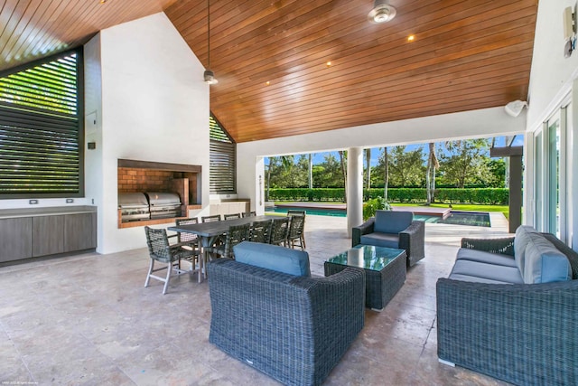 dining area featuring a wealth of natural light, high vaulted ceiling, and wooden ceiling