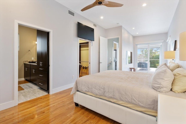 bedroom with ensuite bath, ceiling fan, and light wood-type flooring