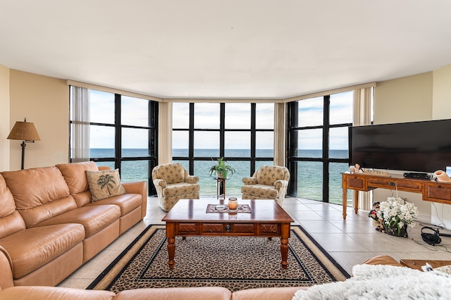 living room featuring a wall of windows and tile patterned floors