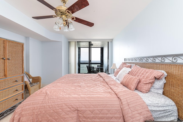 bedroom with access to outside and ceiling fan