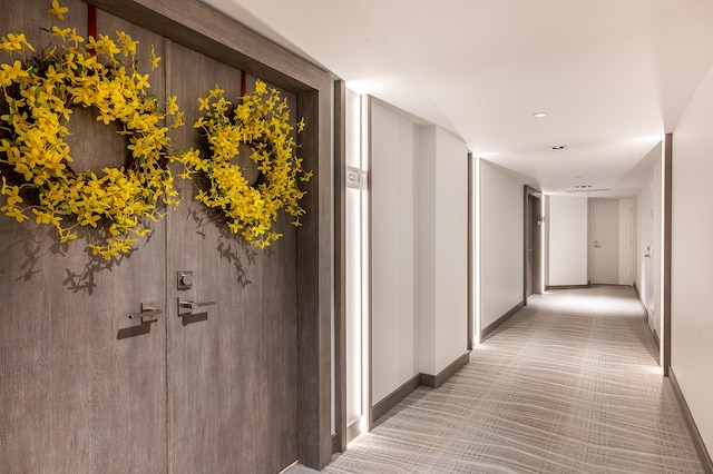 hallway with light carpet