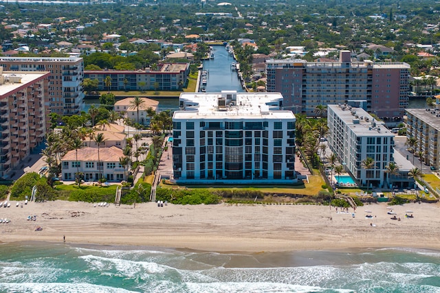 bird's eye view with a beach view and a water view