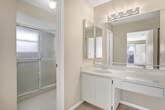 bathroom featuring vanity and walk in shower