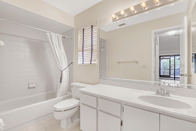 full bathroom featuring tile patterned flooring, shower / bath combination with curtain, vanity, and toilet