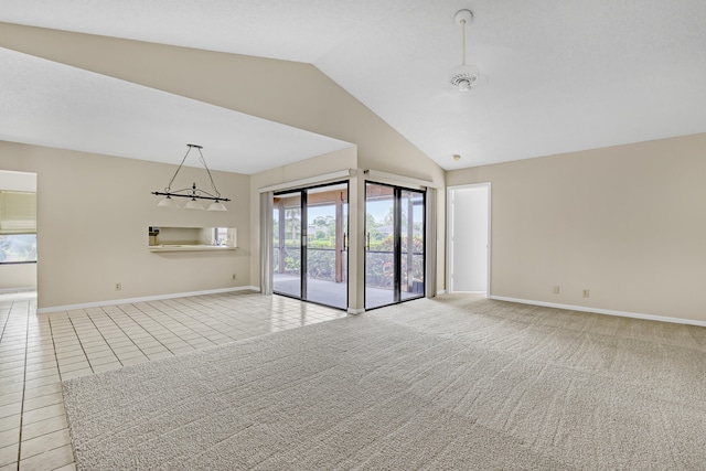 unfurnished living room featuring light tile patterned flooring and lofted ceiling