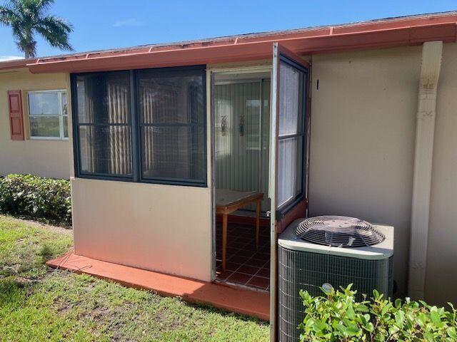 exterior space featuring central AC unit