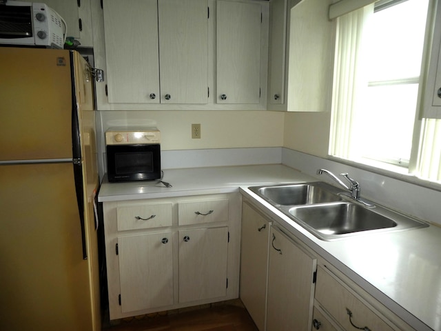 kitchen with white refrigerator and sink