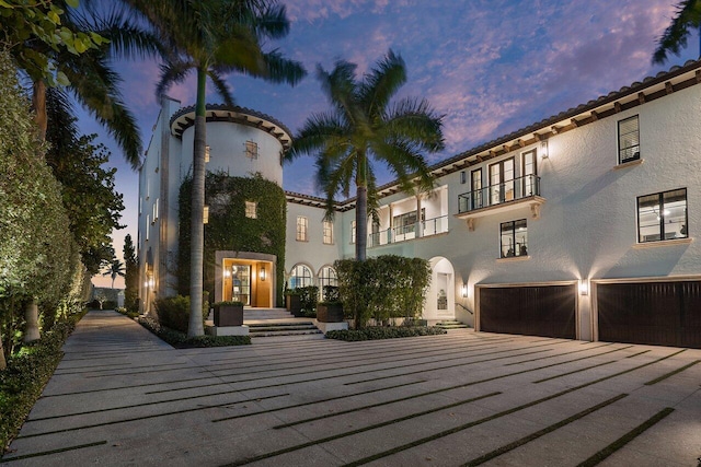 mediterranean / spanish-style home featuring a garage