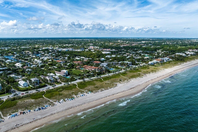 birds eye view of property featuring a water view and a view of the beach