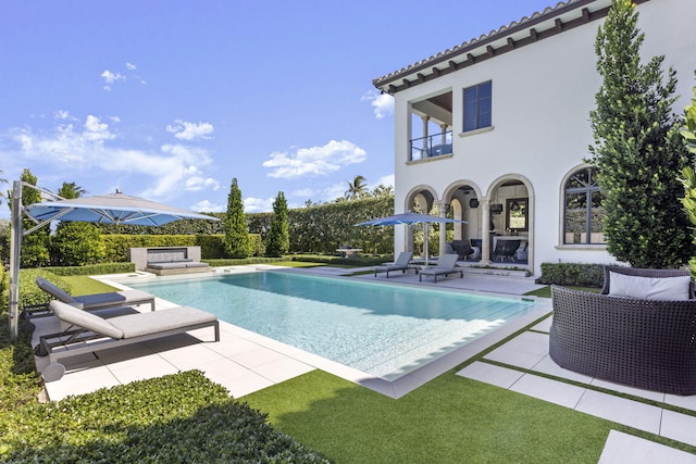 view of swimming pool with a patio area