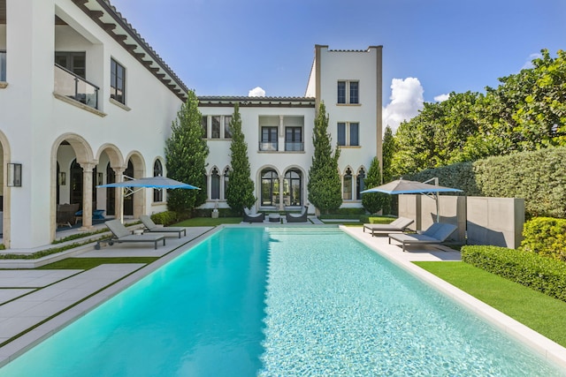 view of swimming pool with a patio area