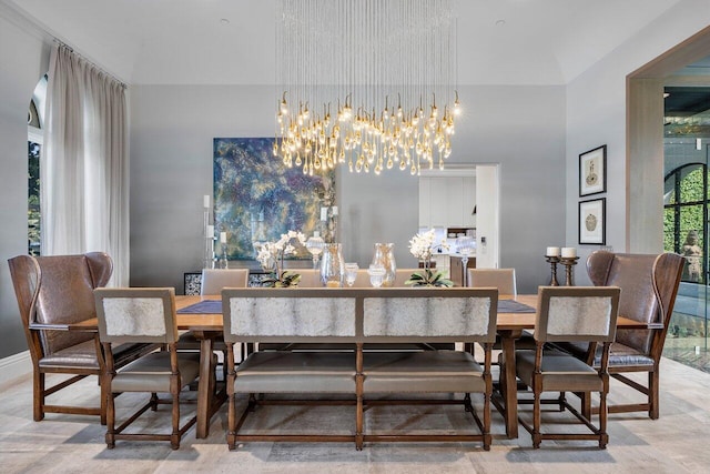 dining space with a notable chandelier