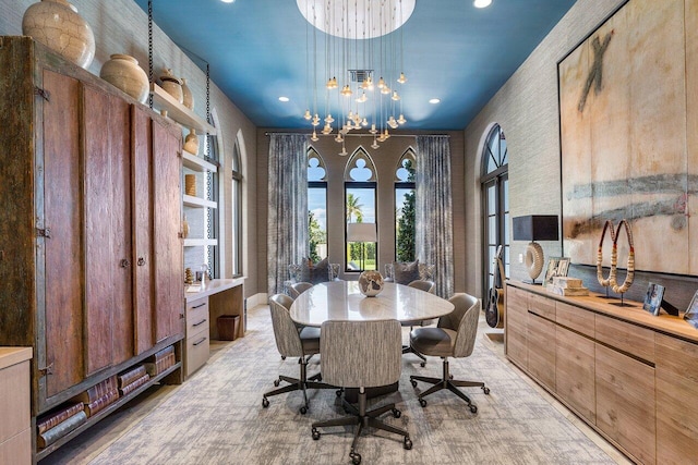 dining room featuring french doors and an inviting chandelier