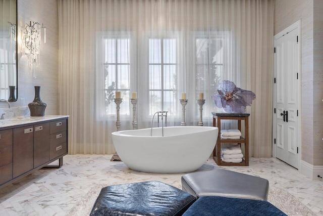 bathroom with plenty of natural light and vanity