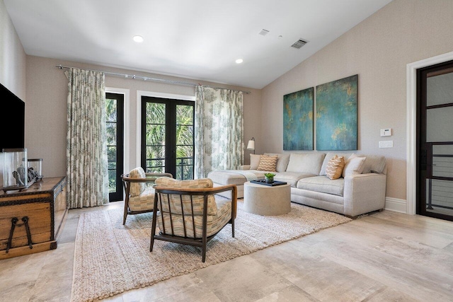 living room featuring french doors and vaulted ceiling