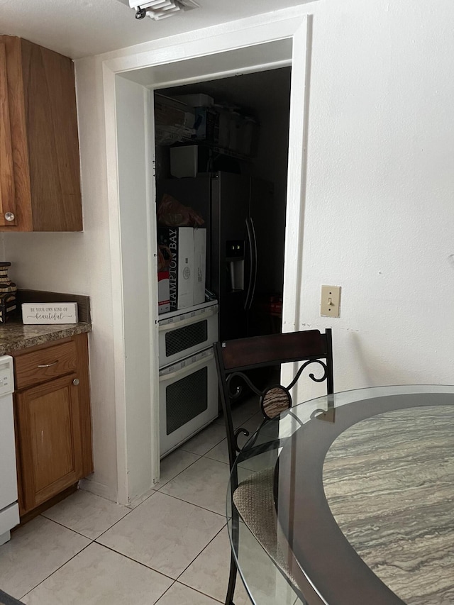 dining room featuring light tile floors