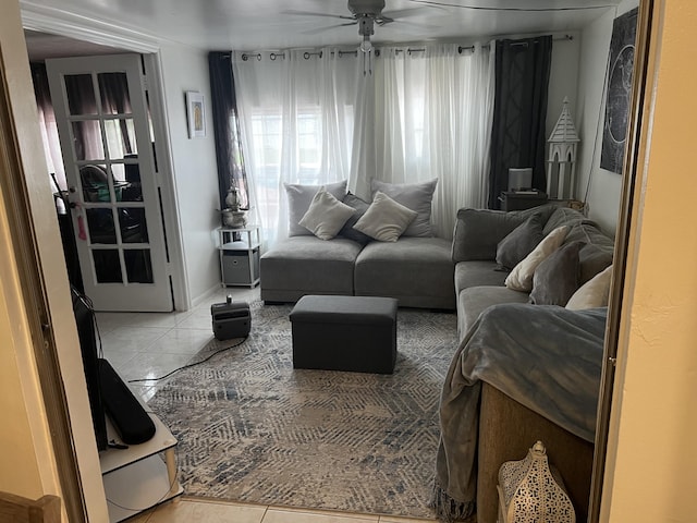 living room featuring ceiling fan and light tile floors